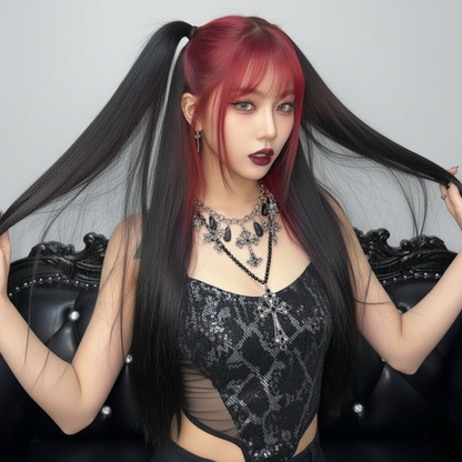 Woman with red hair and black lace top sitting on a decorative chair.