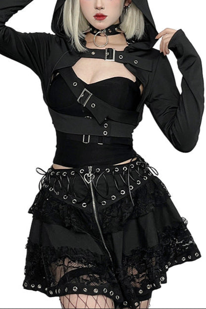 Person wearing a black gothic outfit with a hood on a white background
