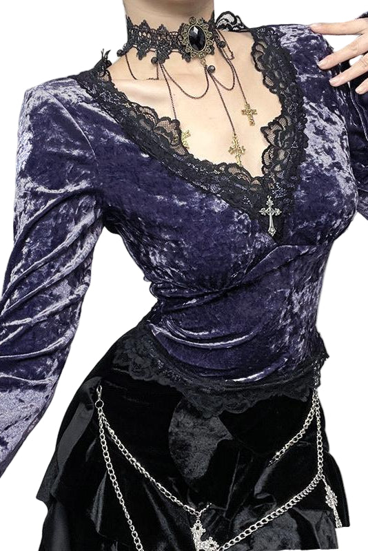 Purple velvet top with lace details and black skirt in a decorative setting