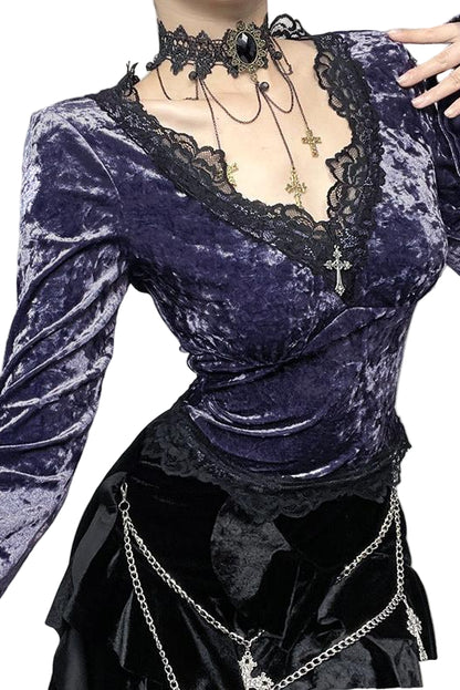 Purple velvet top with lace details and black skirt in a decorative setting