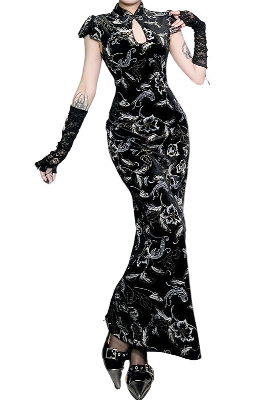 Black floral patterned dress worn by a model on a white background