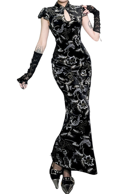 Black floral patterned dress worn by a model on a white background