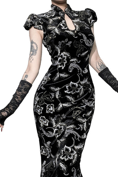 Black floral dress with lace sleeves and gloves on a white background