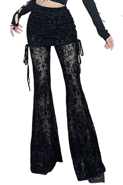 Person wearing black lace pants in a room with decorative elements.