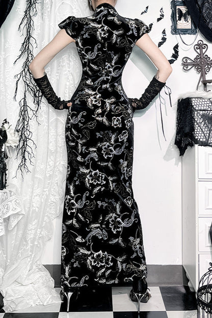 Person wearing a black floral dress in a decoratively styled room with white curtains and black and white checkered floor.