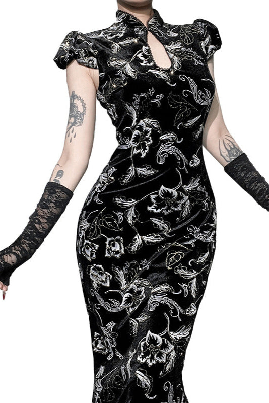 Black floral dress with lace sleeves and gloves on a white background