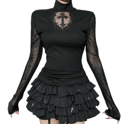 Black long-sleeve top with sheer sleeves and a black skirt on a white background