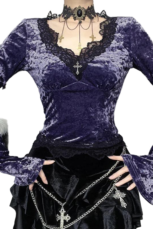 Purple velvet top with lace details on a mannequin against a neutral background