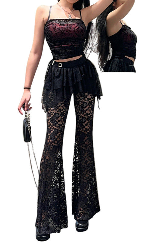 Woman wearing a black lace outfit standing in front of a mirror.